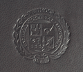 debossed seal on black leather