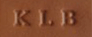 debossed initials on British tan leather